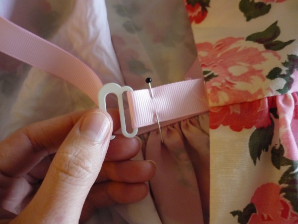 loop the ribbon through the hook and pin
