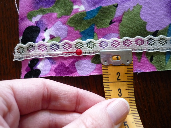 pin lace to the raw edge, lining up lace line with seamline