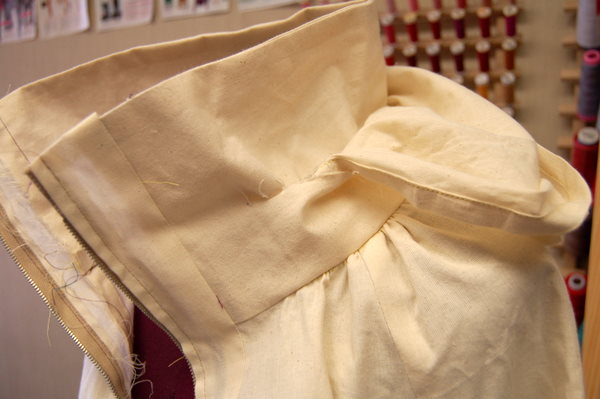 cut a slit in collar, instead of inserting the zipper