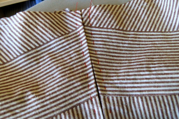 stripes meeting along zipper