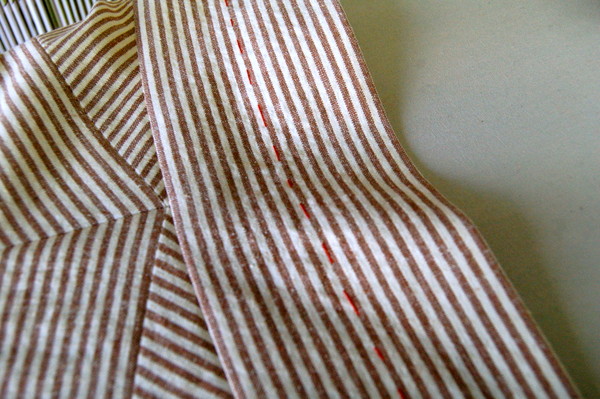fold line of waistband lined up on a stripe